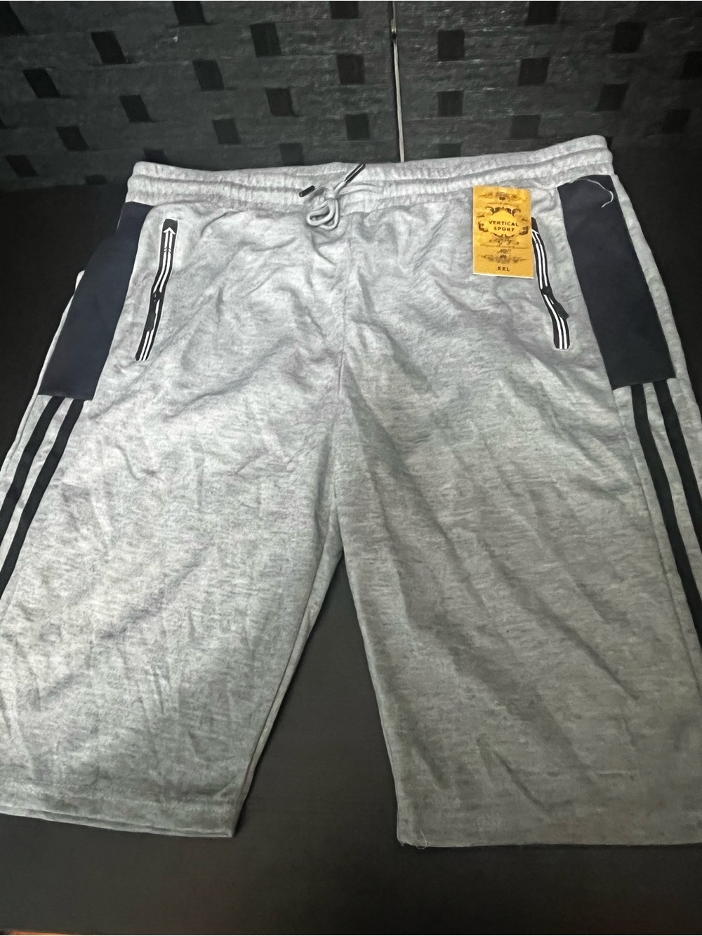 Men’s Vertical Sport gray shorts with black stripes on sides, size XXL